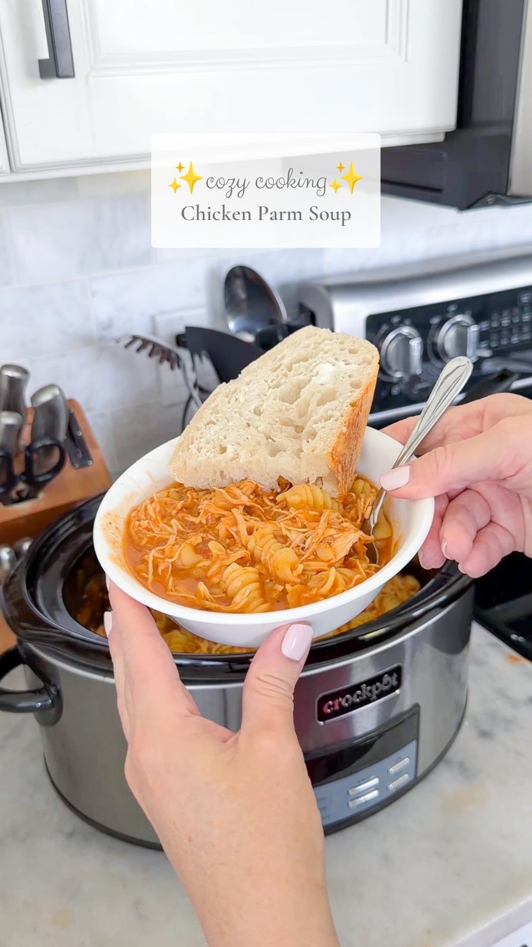 This chicken parm soup got me in the mood for all the fall cozy meals and yummy desserts 😋Recipe:Crockpot Chicken Parmesan Soup- 1.5 Ib chicken breasts- 1 jar marinara sauce (24oz)- 4 cups chicken bone broth (love the Kettle & Fire brand)- 1 medium yellow onion, chopped- 3-4 garlic cloves, minced- 1 tbsp tomato paste- 1/2 tbsp Italian seasoning- Salt & pepper to taste- Half a box of dry rotini pasta - 1/3 cup half & half- 1/3 cup shredded Parmesan and more for toppingPlace chicken breasts, marinara, onion, tomato paste, garlic, seasonings, and bone broth in a crockpot & gently stir to combine. Cook on high for 3-4 hours or low for 5-6, until chicken is cooked. Remove chicken from the crockpot and shred. Add chicken back in along with half & half and uncooked pasta. Stir to combine and allow the pasta 20 to 30 minutes to cook. Add in parmesan cheese and give it just a minute to melt. Enjoy!#crockpotmeals #crockpotrecipes #cozymeals #fallrecipe #dinneridea