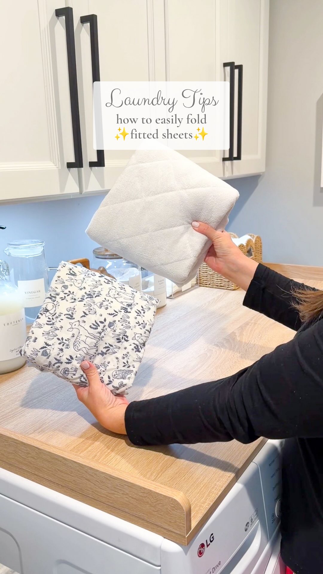 This is the easiest way I’ve learned to fold fitted sheets! Be sure you start on a large enough surface to lay the sheet out flat. I’m doing a crib sheet so it’s small but if you’re folding anything larger, use a bigger surface like a bed or floor. Lay it out as flat as you can to start. Flip the bottom corners inside out and use your hands to push them into the top corners. Now you’re working with a shape close to a rectangle once you adjust the side. Fold down the curved edge at the top towards the middle and pull up the bottom edge. Then fold in thirds or in half and you will have a nicely folded fitted sheet ✨🧺 #laundrytips #fittedsheet #fittedsheetfolding #laundryhack #laundry